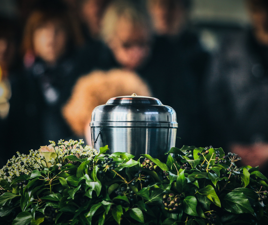 Urn sitting inside a flower arrangement during funeral services near Coon Valley, WI. 