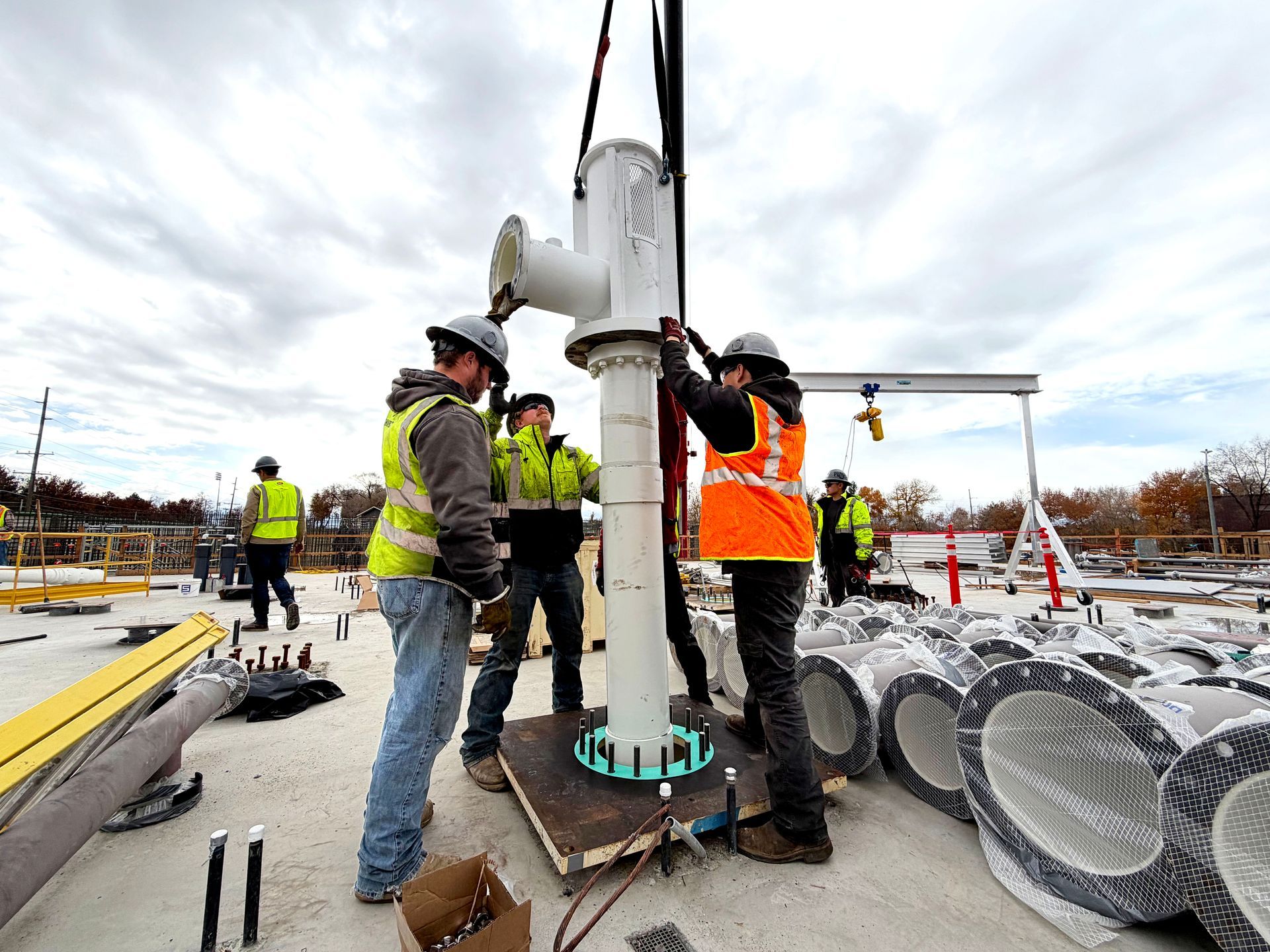 A row of pumps and pipes in a factory.