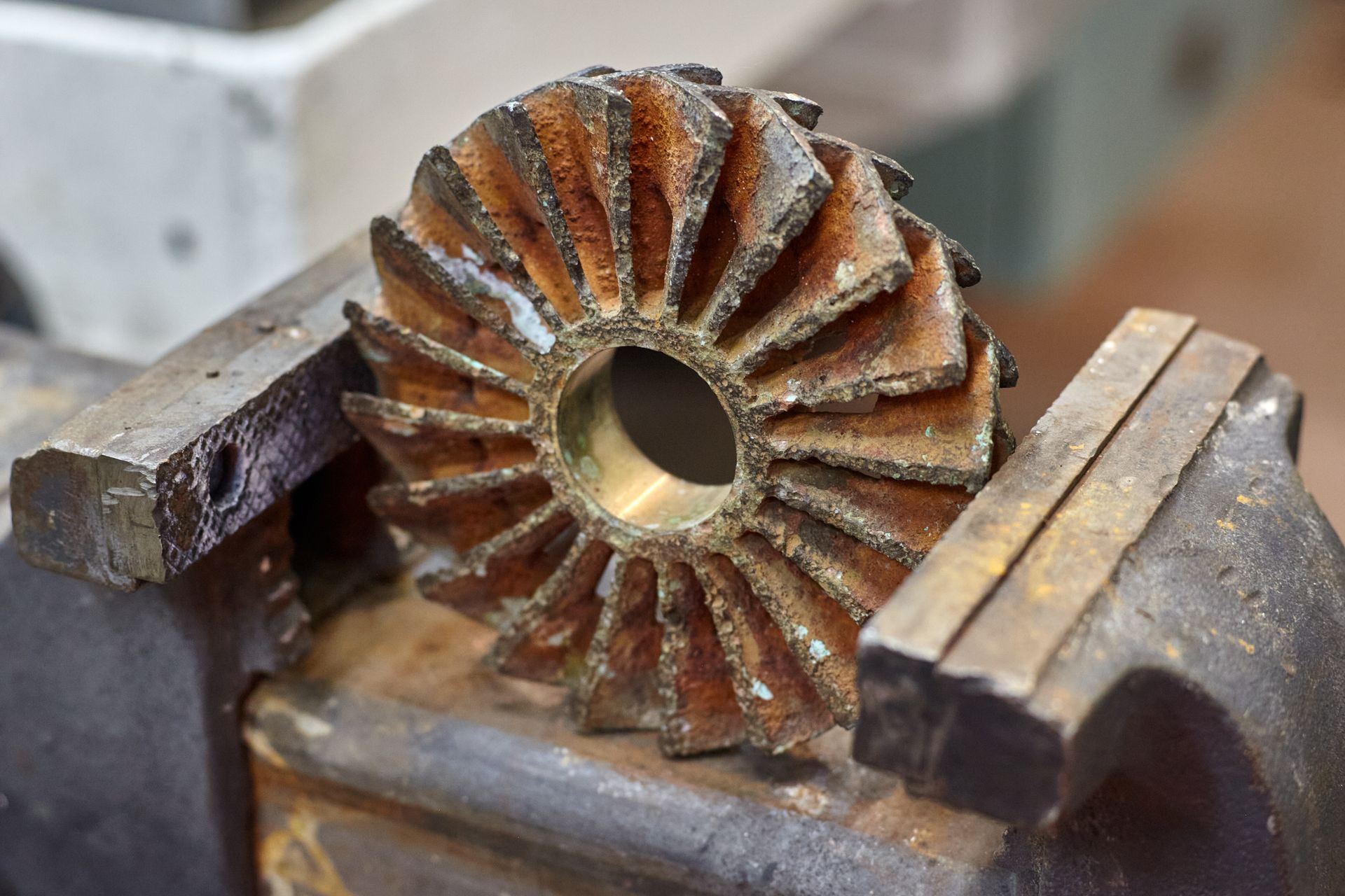 A black and white photo of a metal object with a hole in the middle