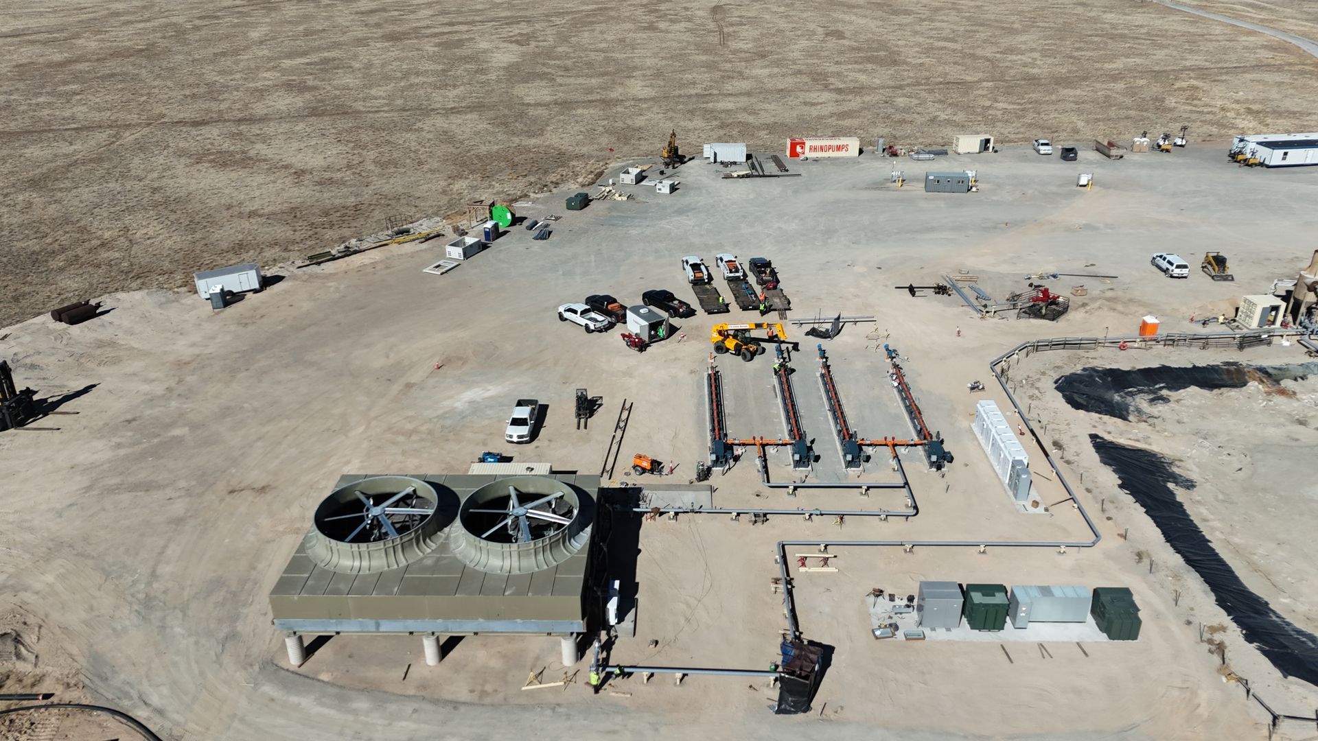 A blue pump is sitting on top of a white surface.