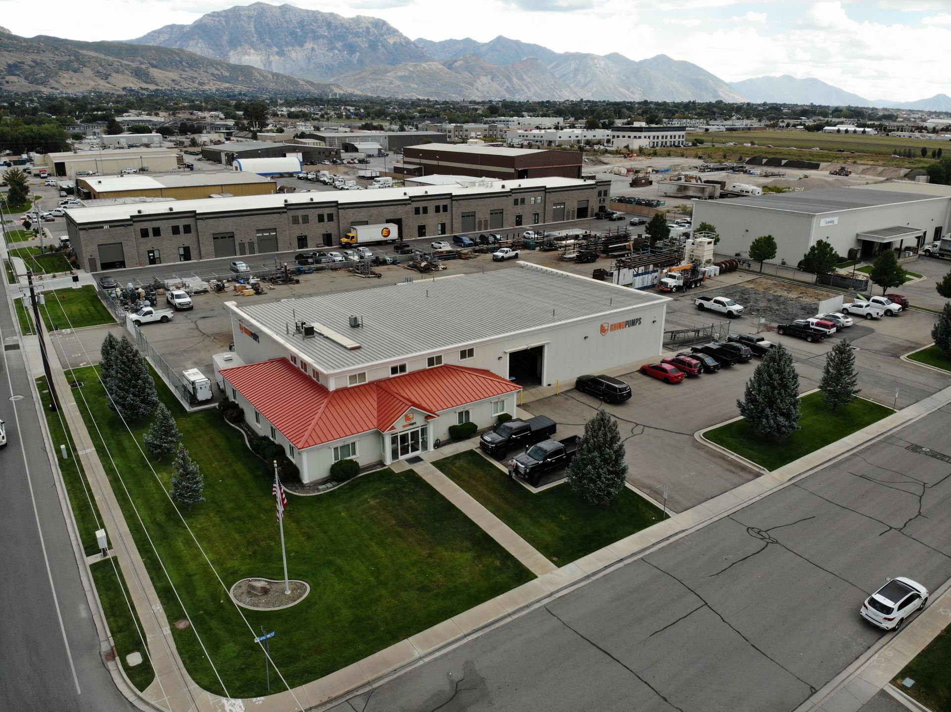 An aerial view of a building with a red roof