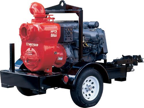 A red water pump is on a trailer with a diesel engine.