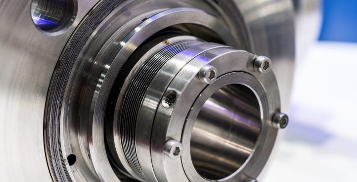 A close up of a stainless steel seal on a machine.