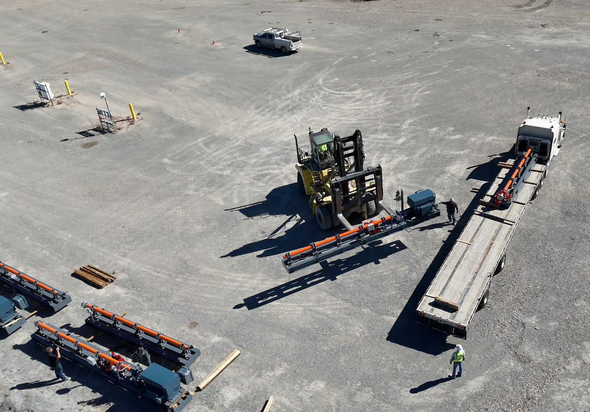A blue pump is sitting on top of a white surface.
