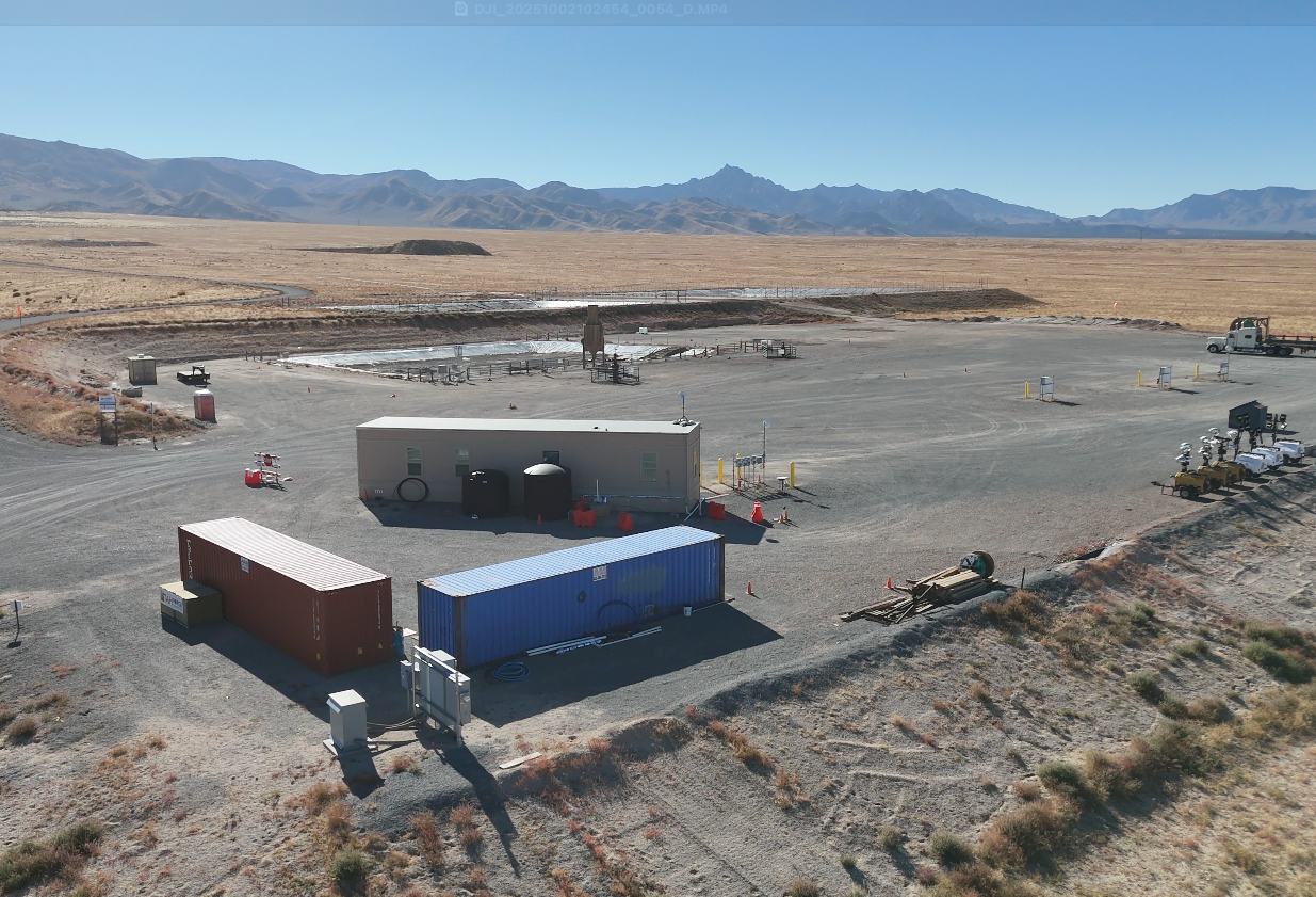 A blue pump is sitting on top of a white surface.