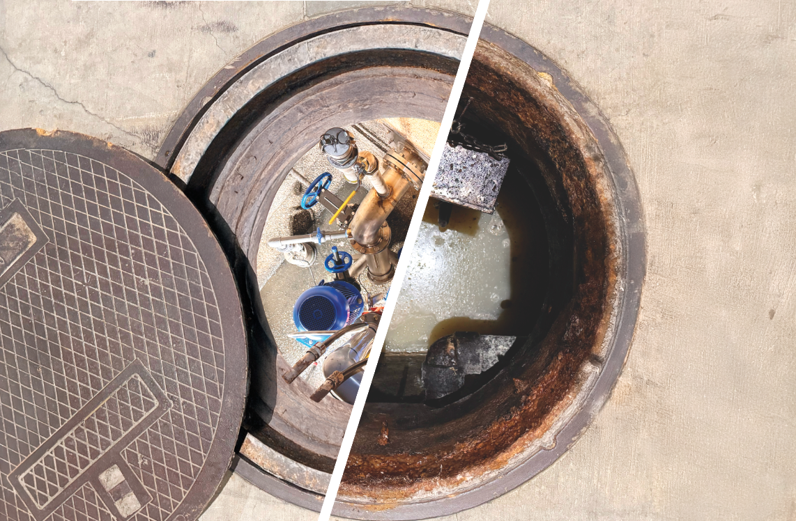 A manhole cover is open and filled with water.