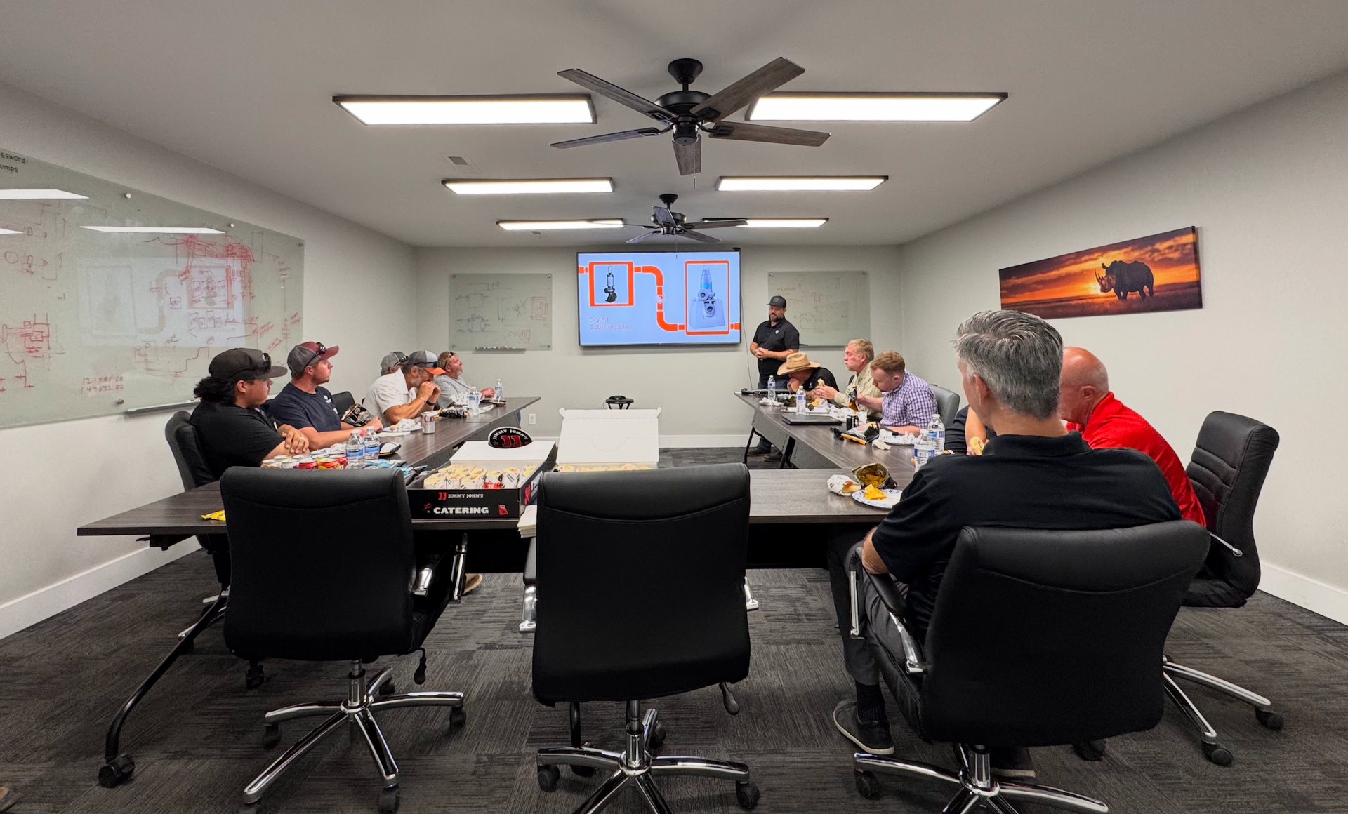 A group of construction workers are working on a well.