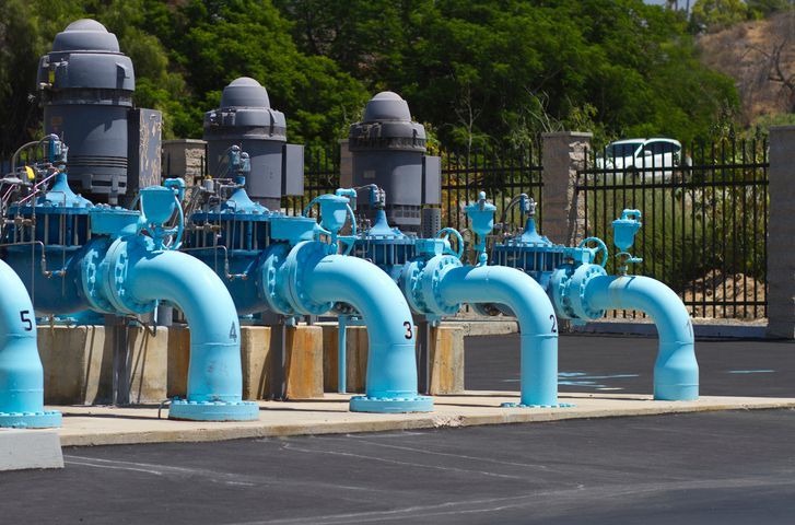 A row of blue pipes with the number 5 on them
