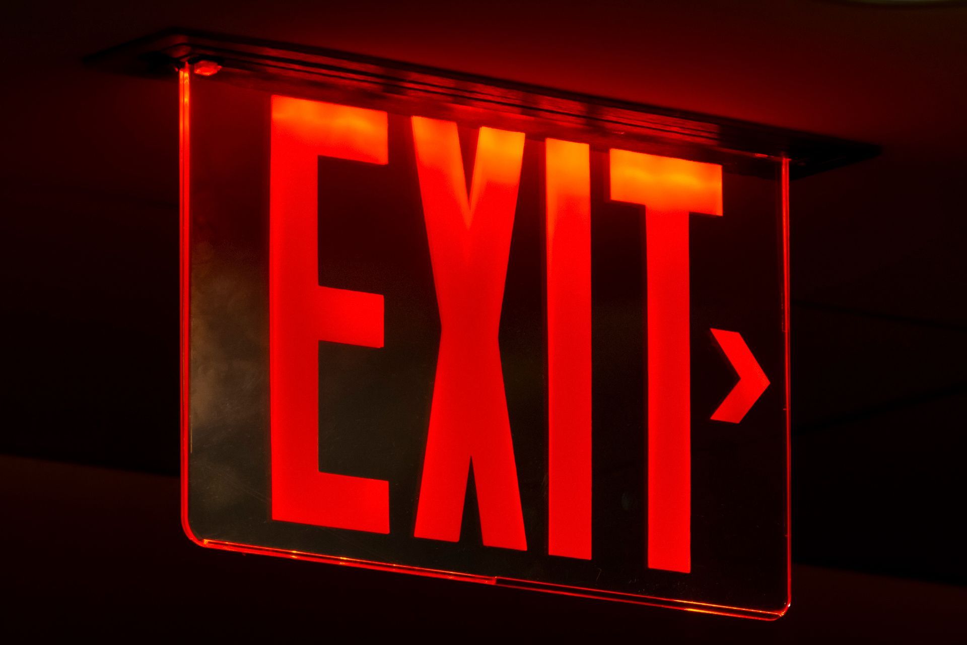 Exit sign pointing the direction to the nearest exit