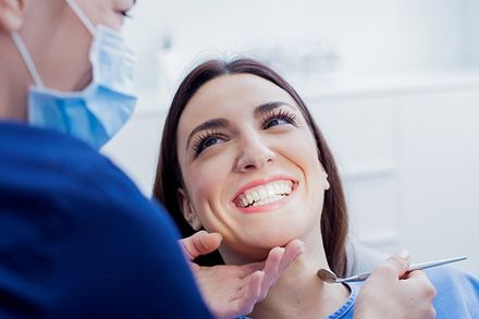 Cosmetic Dental Care — Girl Smiling To Her Dentist in Greensboro, NC