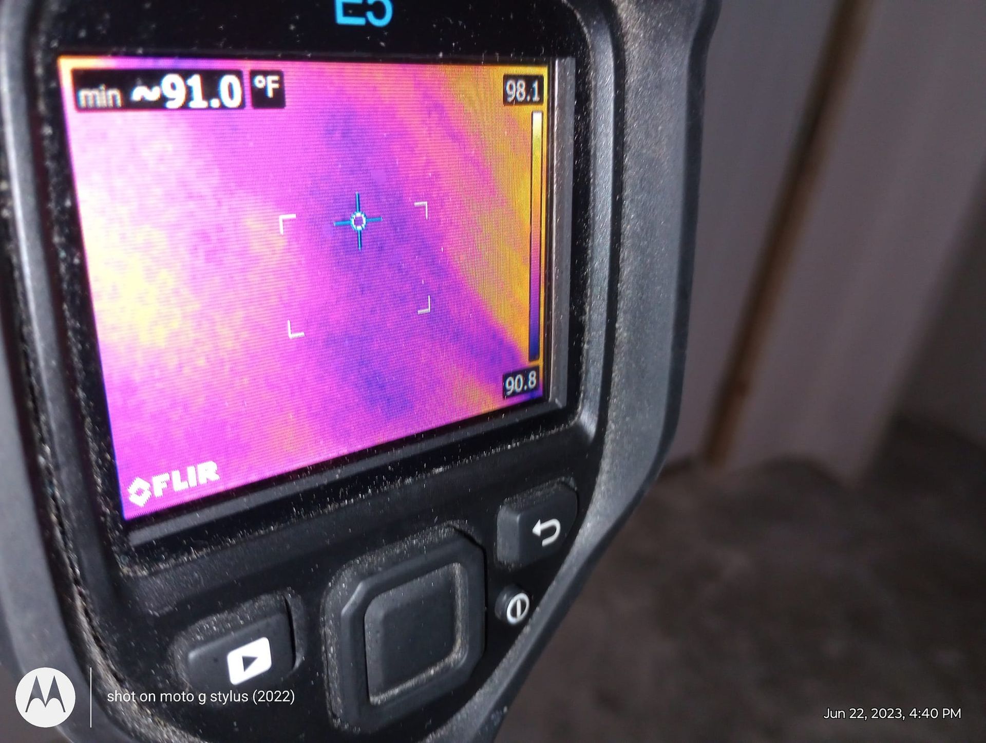 A thermal camera shows a temperature of 91.0 degrees fahrenheit