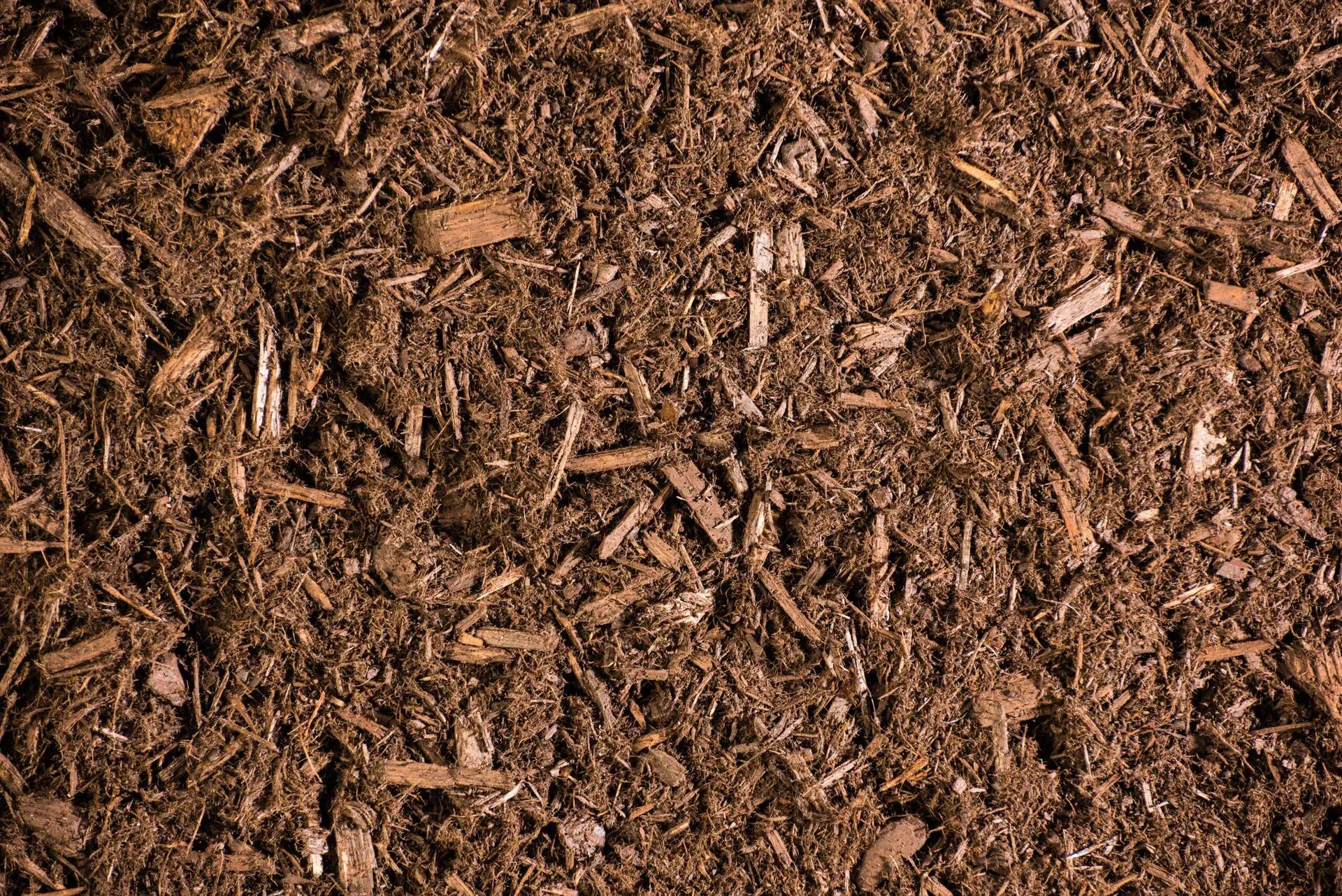 A close up of a pile of brown mulch.