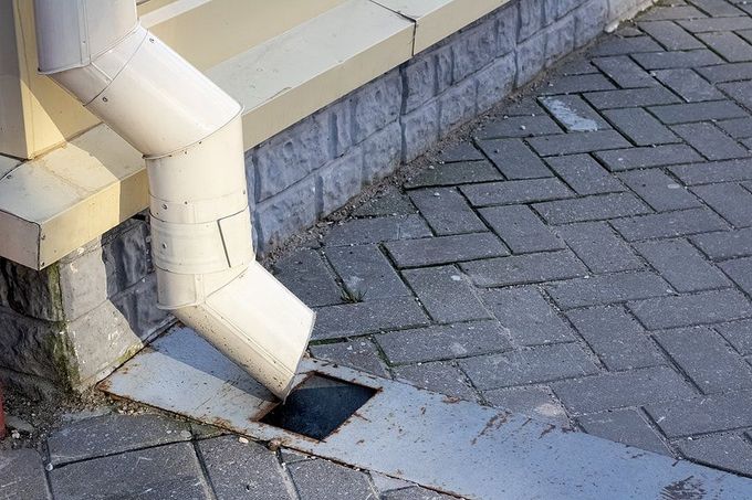 plumber cleaning the sink drainage