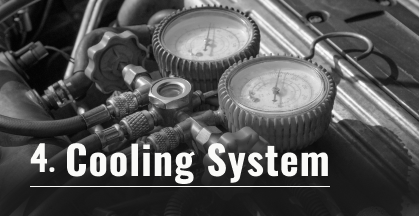 Close-up of a car brake system; a rotor, caliper, and pads. Text says 