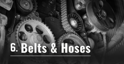 Close-up of a car brake system; a rotor, caliper, and pads. Text says 