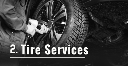 Close-up of a car brake system; a rotor, caliper, and pads. Text says 