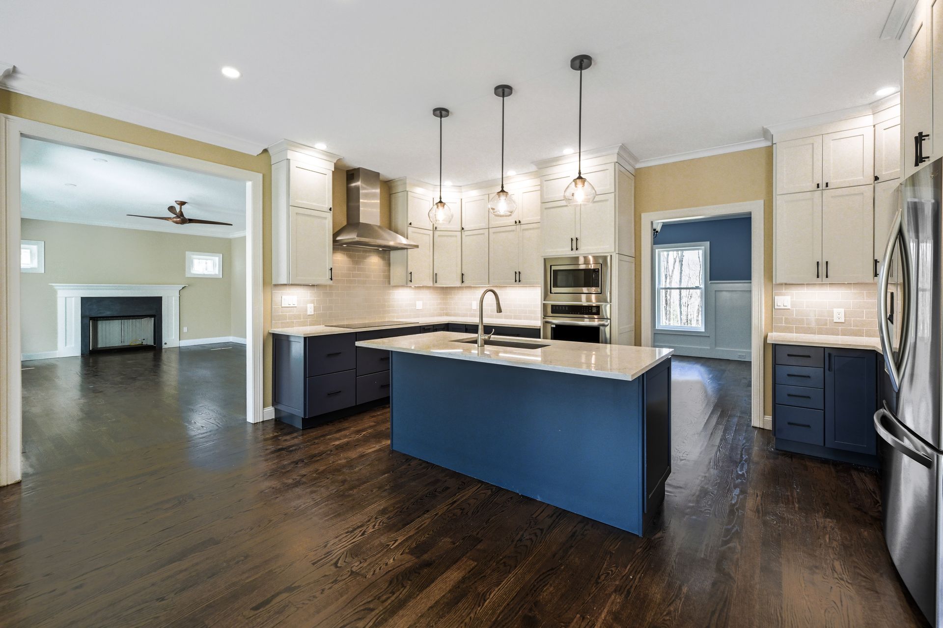 A kitchen with a large blue island in the middle