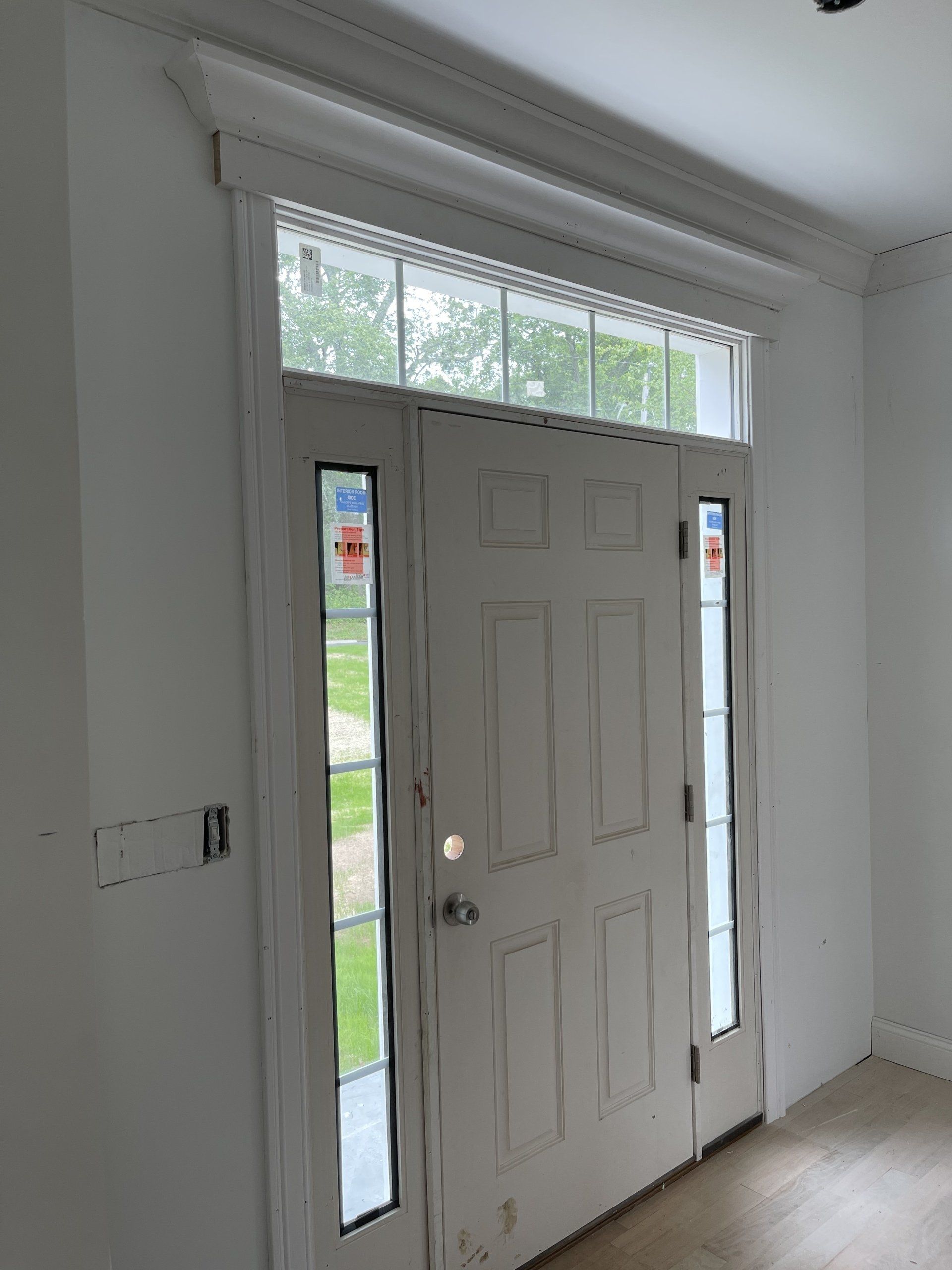 A white door with a window above it