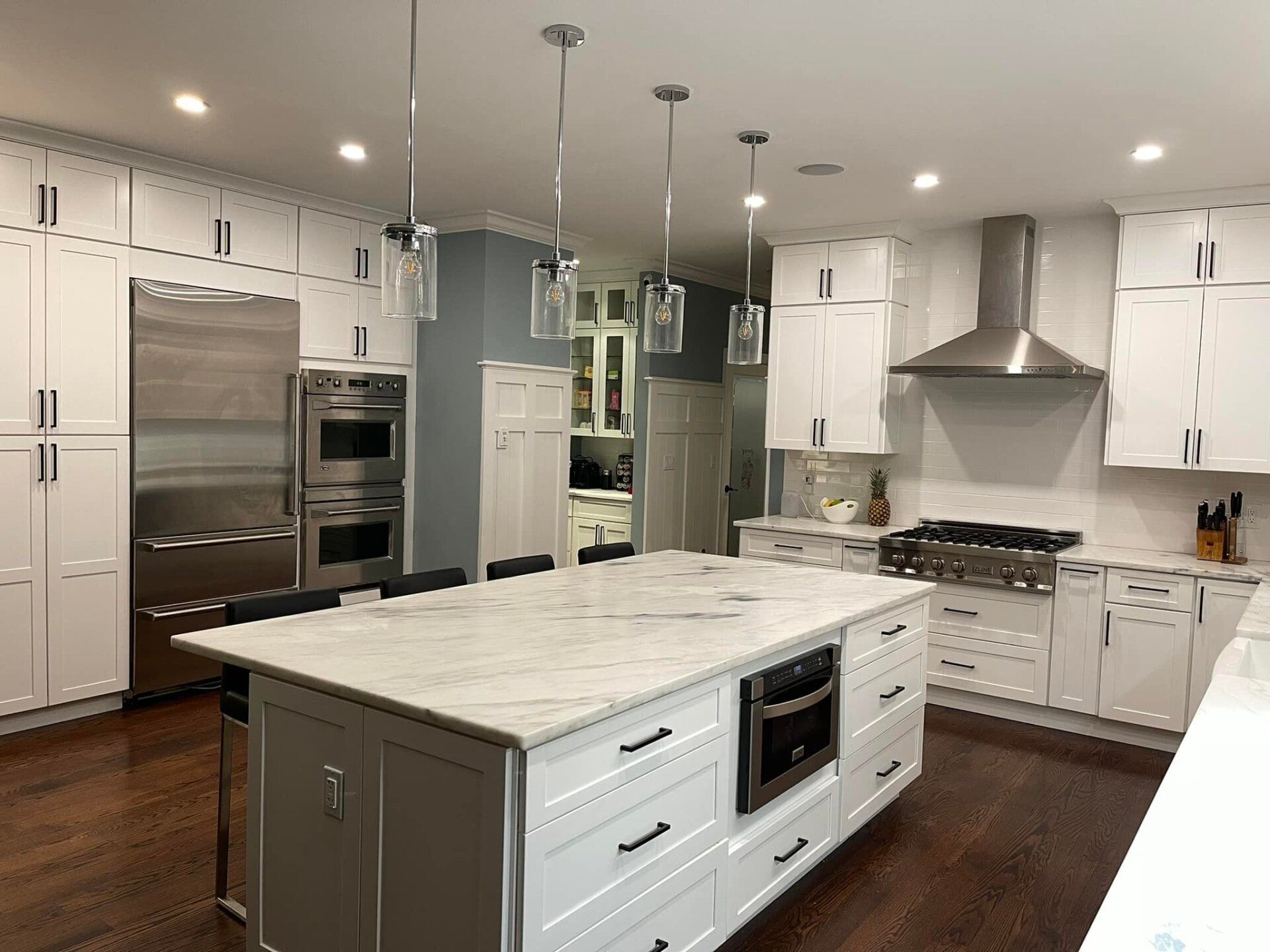 There is a large island in the middle of the kitchen.