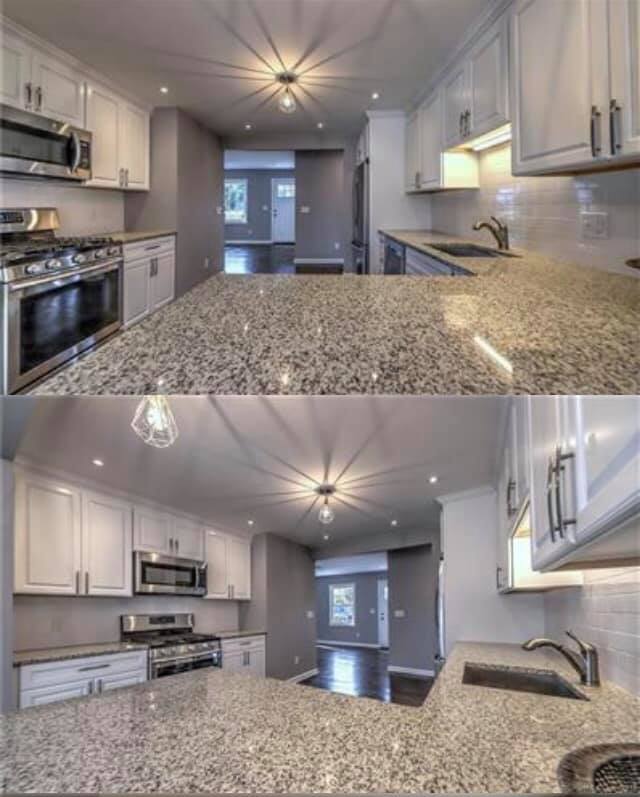 A kitchen with granite counter tops and white cabinets