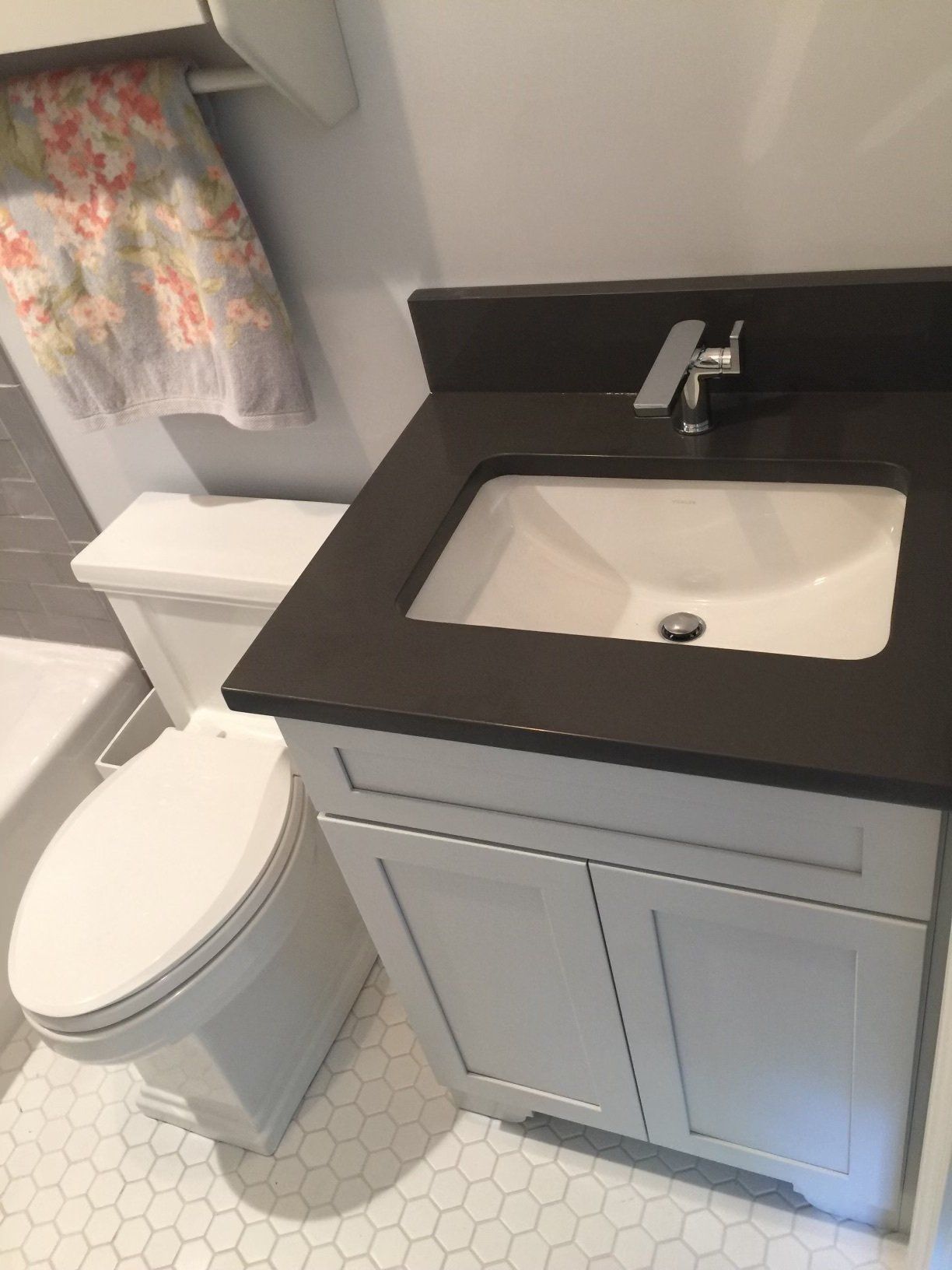 A bathroom with a sink , toilet and bathtub