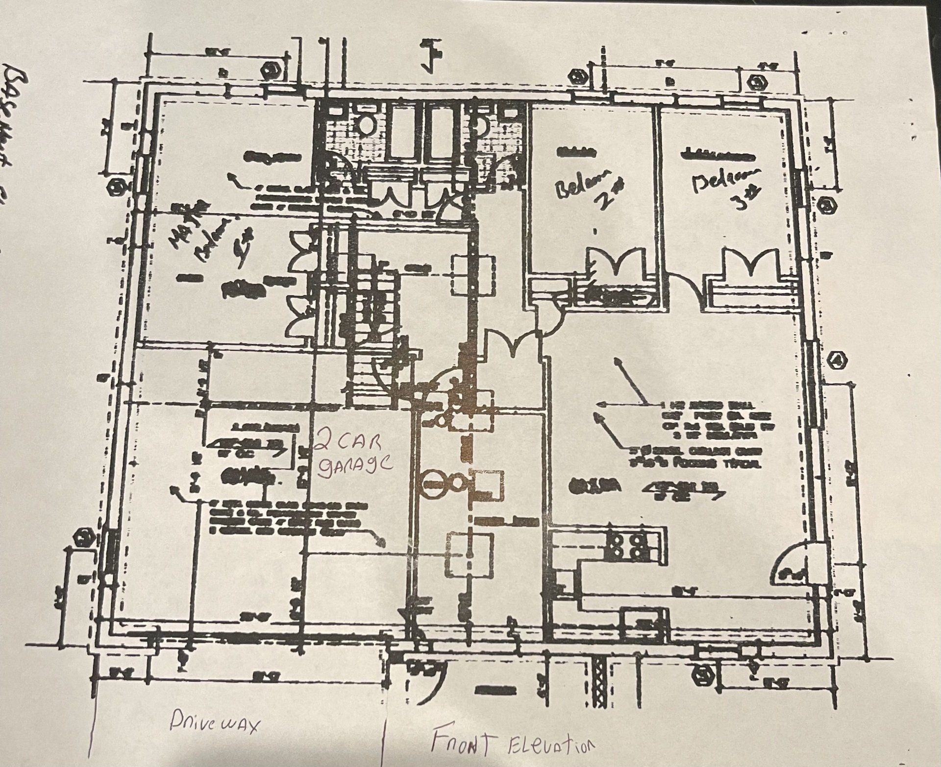 A black and white drawing of a house with the word front visible