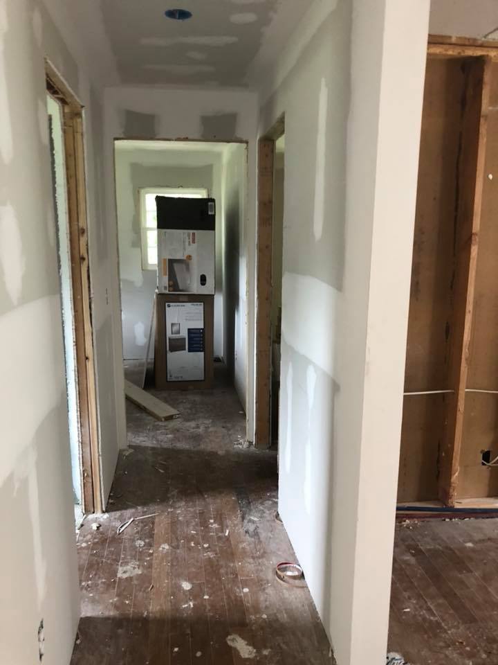 A hallway in a house that is being remodeled.
