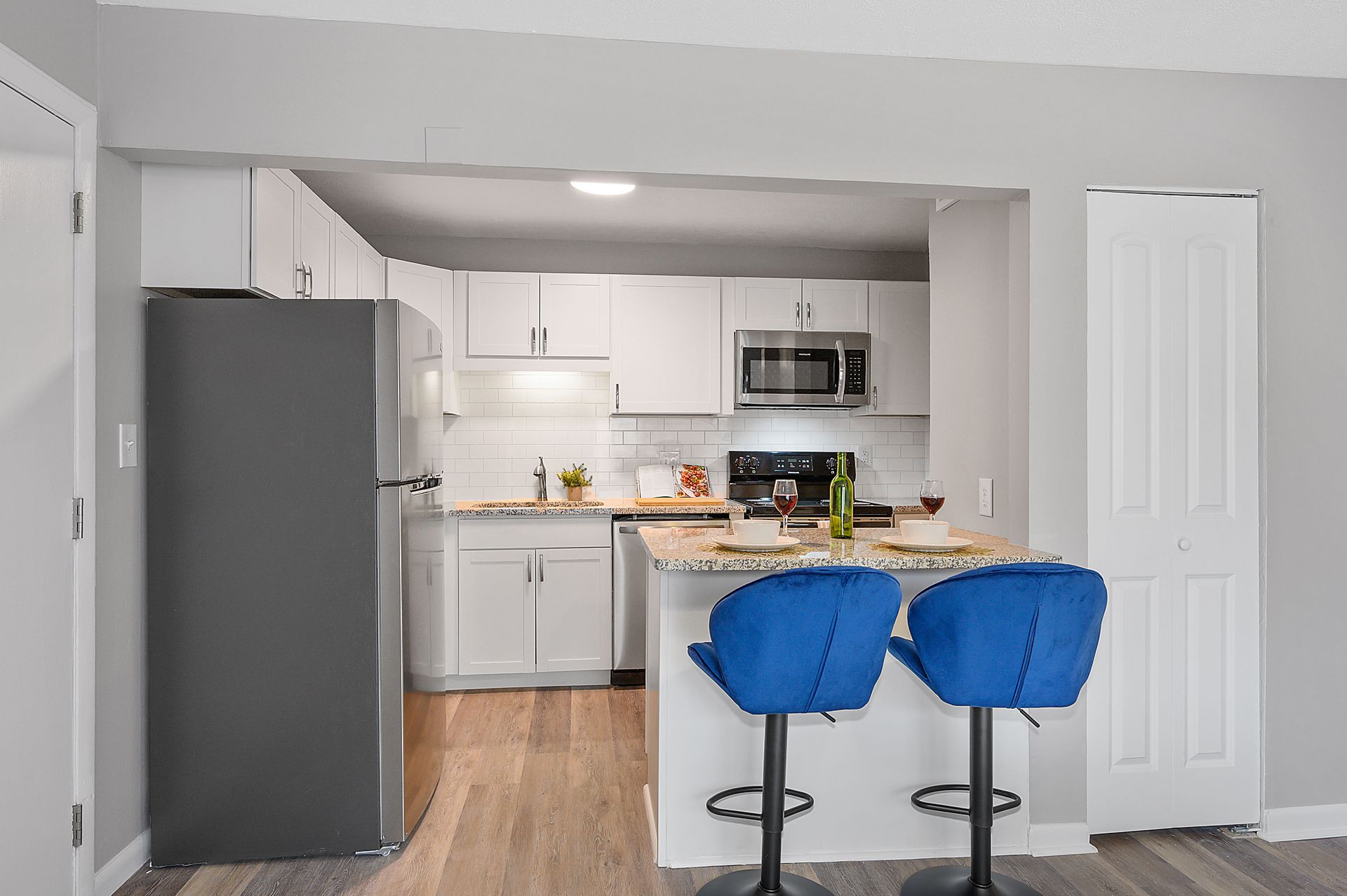 Photo of 8Ninety Kitchen with Blue Barstools