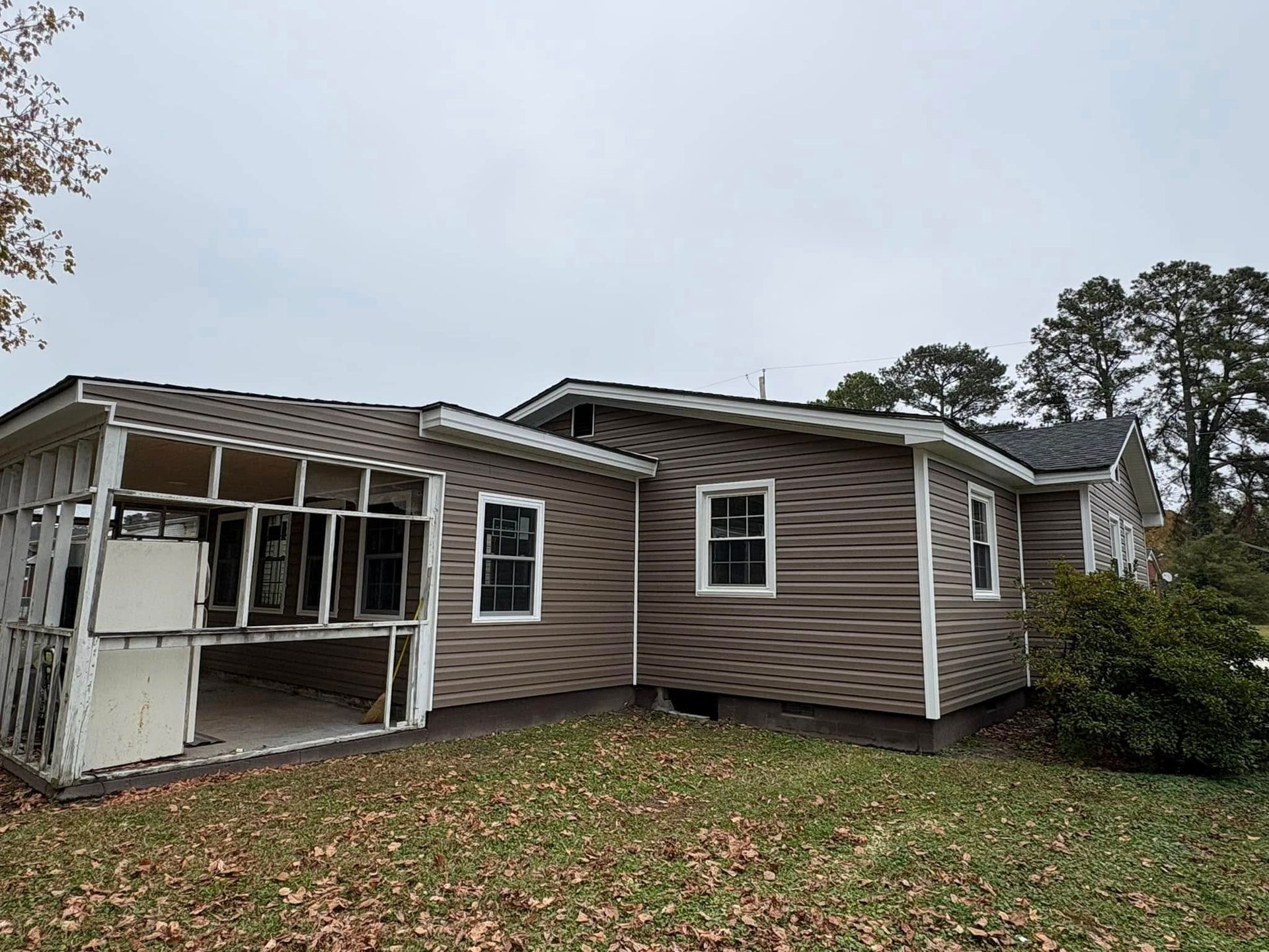 A house with a lot of windows is being remodeled.