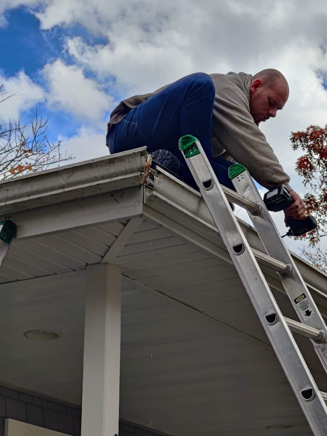 David Williamson Installing seamless gutters/ New England Guttr Systems Call today for a free estimate 603-674-0567