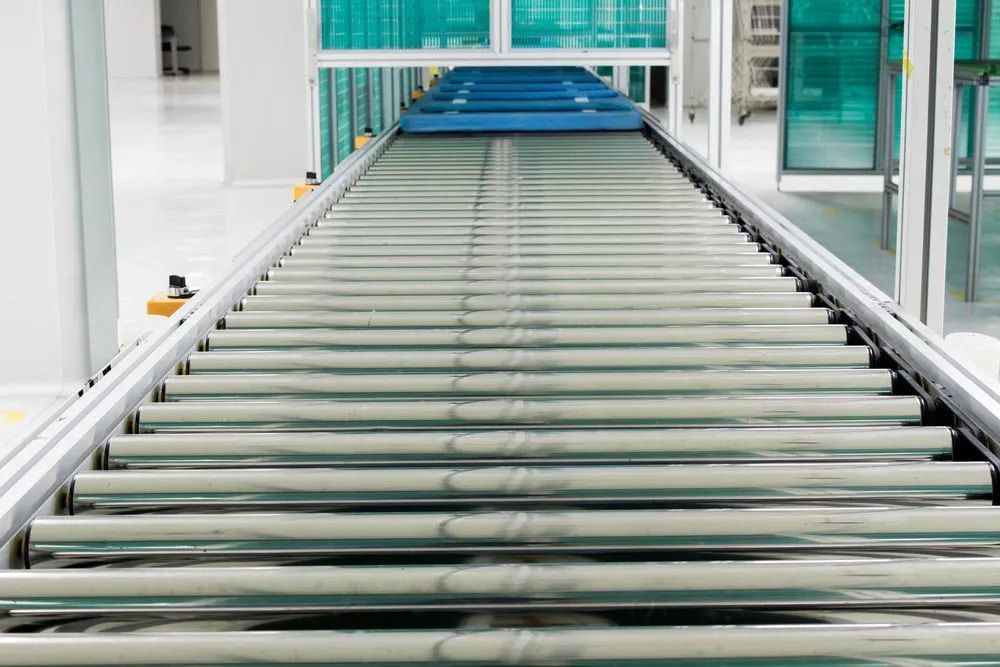 A Conveyor Belt Is Moving Through A Factory — HardRok Engineering Pty Ltd In Mount Isa, QLD