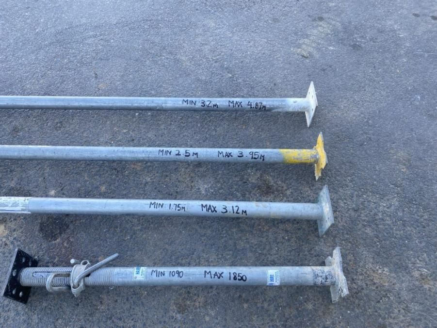 Three Metal Poles Are Sitting on a Concrete Surface — Hamblin Hire in Albury, NSW
