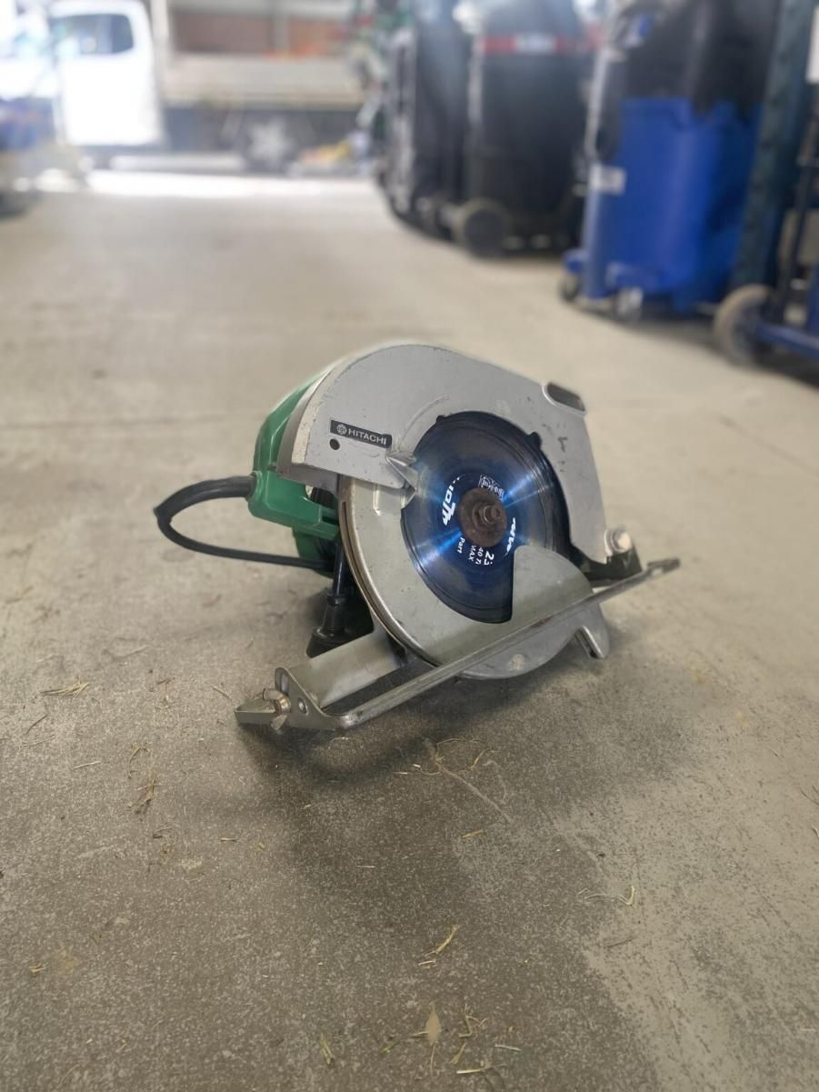 A Circular Saw is Sitting on the Floor in a Garage — Hamblin Hire in Albury, NSW