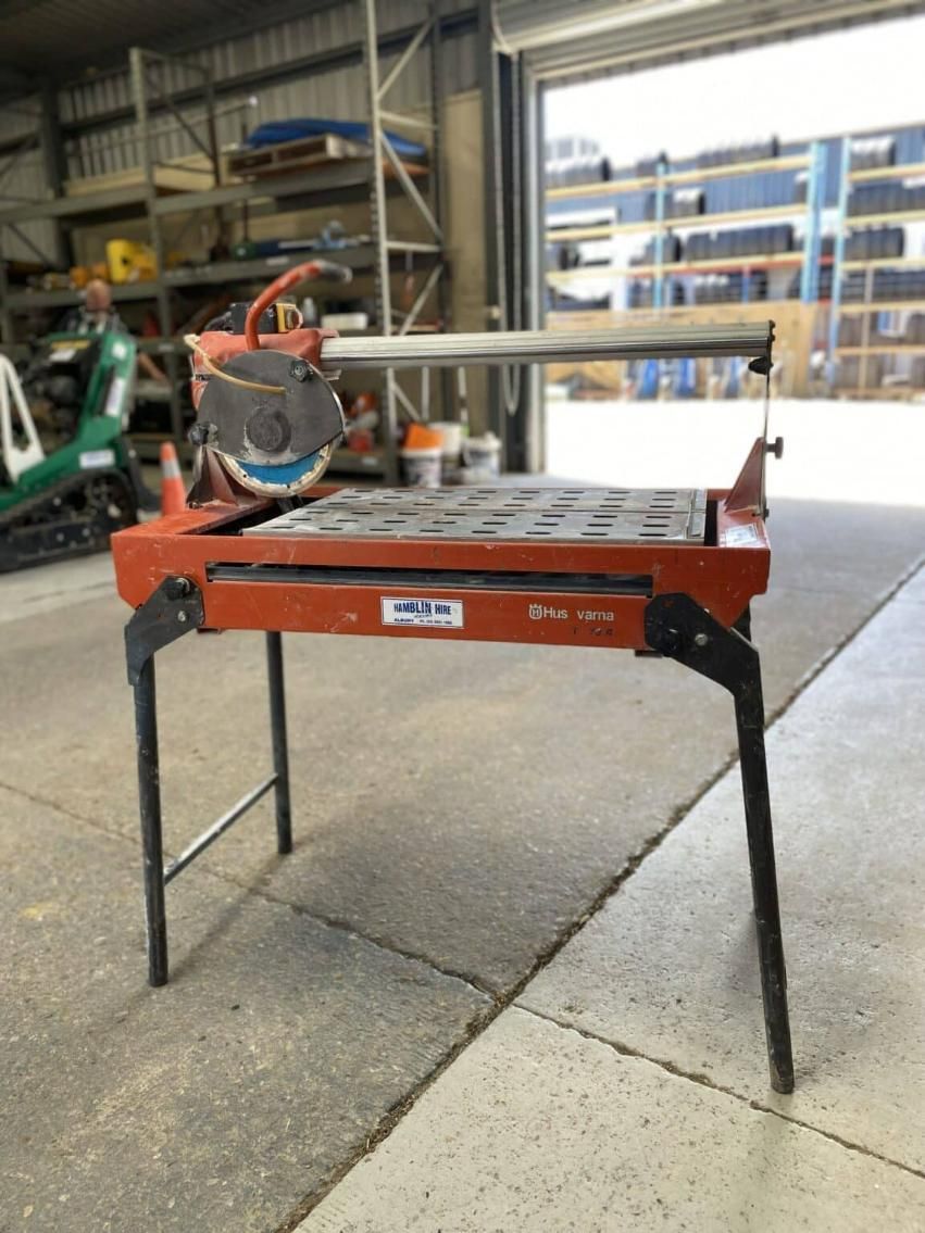A Circular Saw is Sitting on a Table in a Garage — Hamblin Hire in Albury, NSW