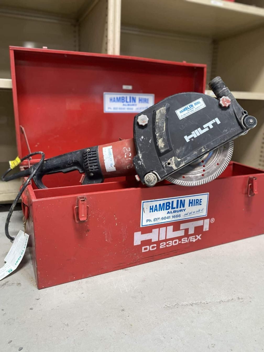 A Circular Saw is Sitting in a Red Box — Hamblin Hire in Albury, NSW