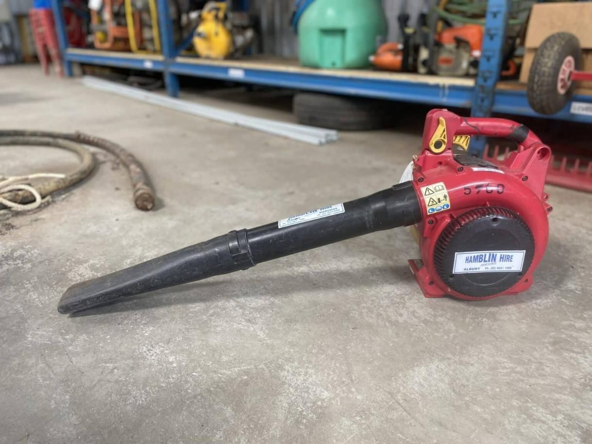 A Red Blower is Sitting on the Floor in a Warehouse — Hamblin Hire in Albury, NSW