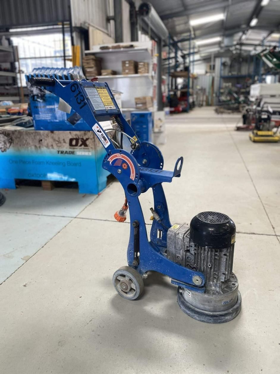 A Blue Machine is Sitting on the Floor in a Warehouse — Hamblin Hire in Albury, NSW