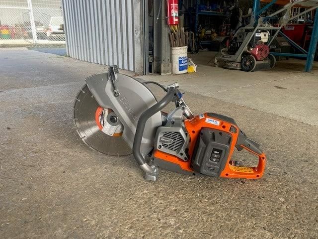 A Concrete Saw is Sitting on the Ground in Front of a Building — Hamblin Hire in Albury, NSW