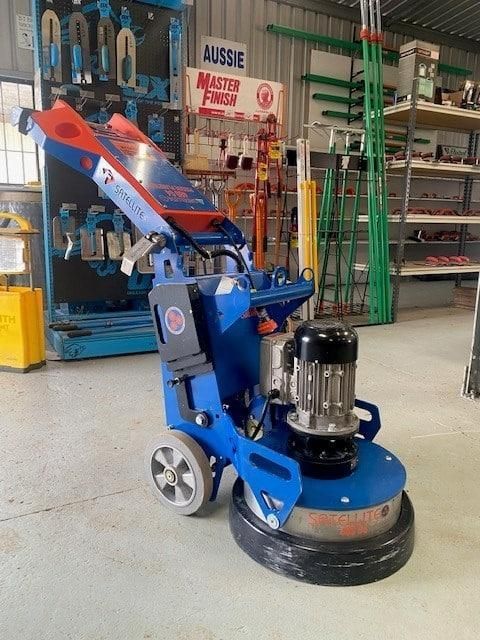 A Machine is Sitting in Front of a Sign That Says Aussie — Hamblin Hire in Albury, NSW