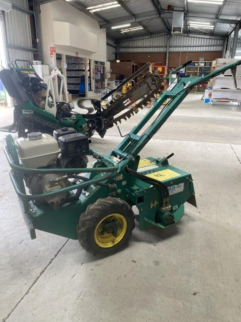 A Green Tractor is Parked in a Warehouse — Hamblin Hire in Albury, NSW