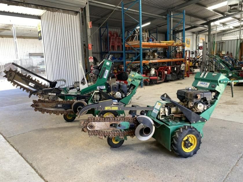 Two Green Tractors Are Parked in a Warehouse — Hamblin Hire in Albury, NSW