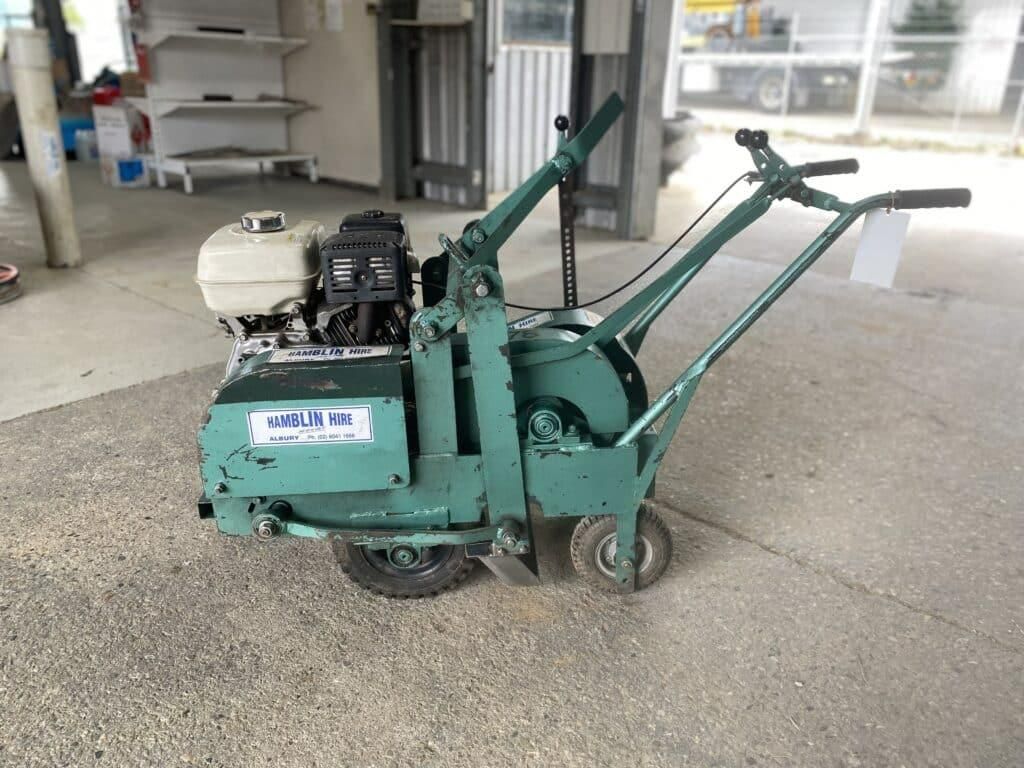 A Green Machine With Wheels is Sitting on the Ground in a Room — Hamblin Hire in Albury, NSW