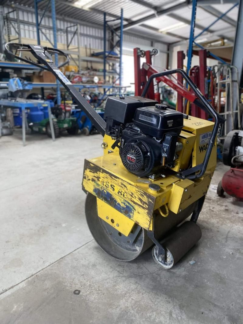 A Yellow and Black Machine is Sitting in a Warehouse — Hamblin Hire in Albury, NSW