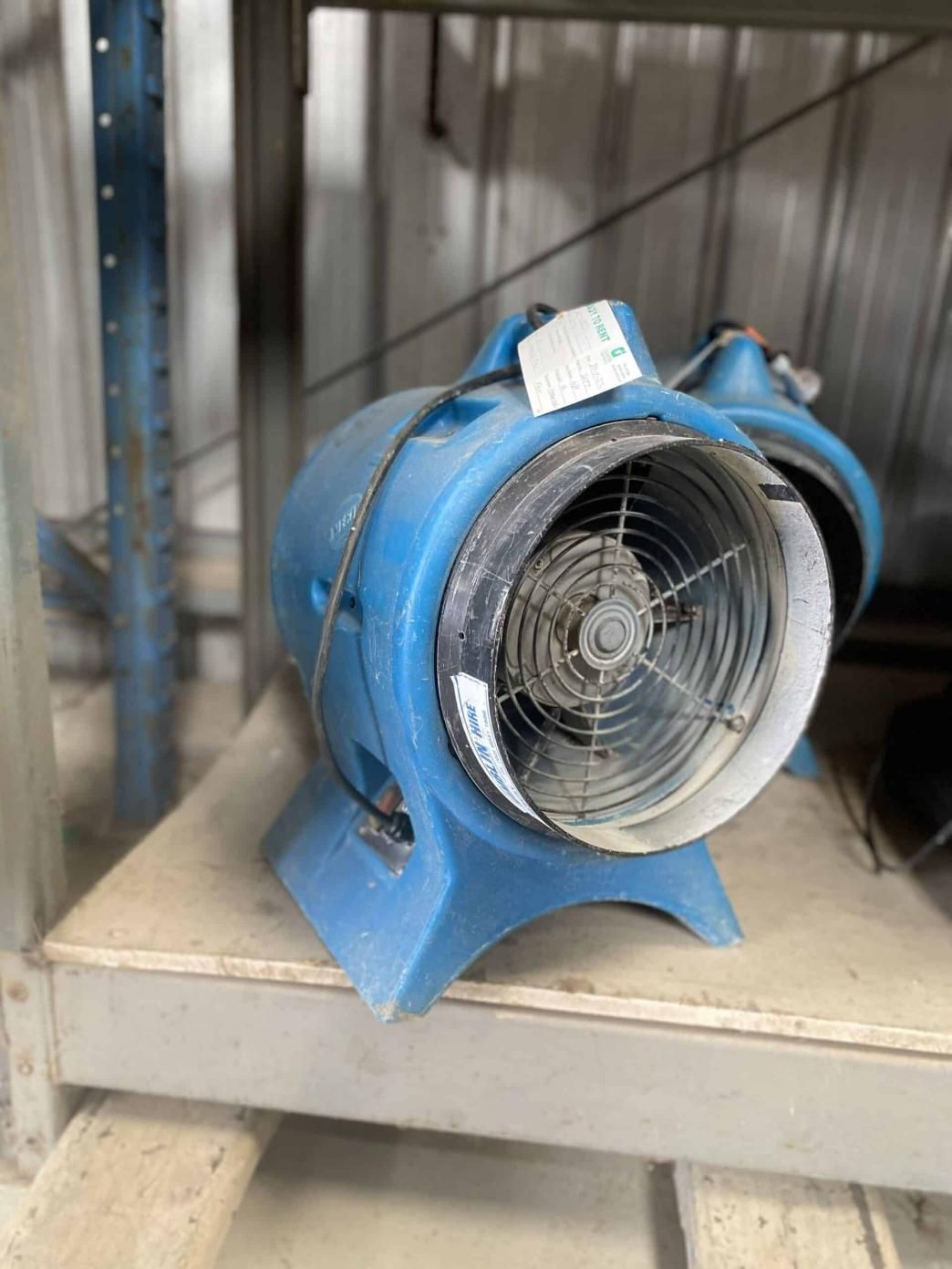A Blue Fan is Sitting on Top of a Shelf — Hamblin Hire in Albury, NSW