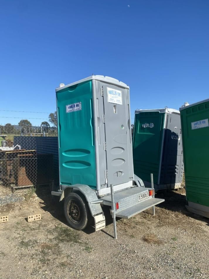 A Green and Gray Portable Toilet is on a Trailer — Hamblin Hire in Albury, NSW