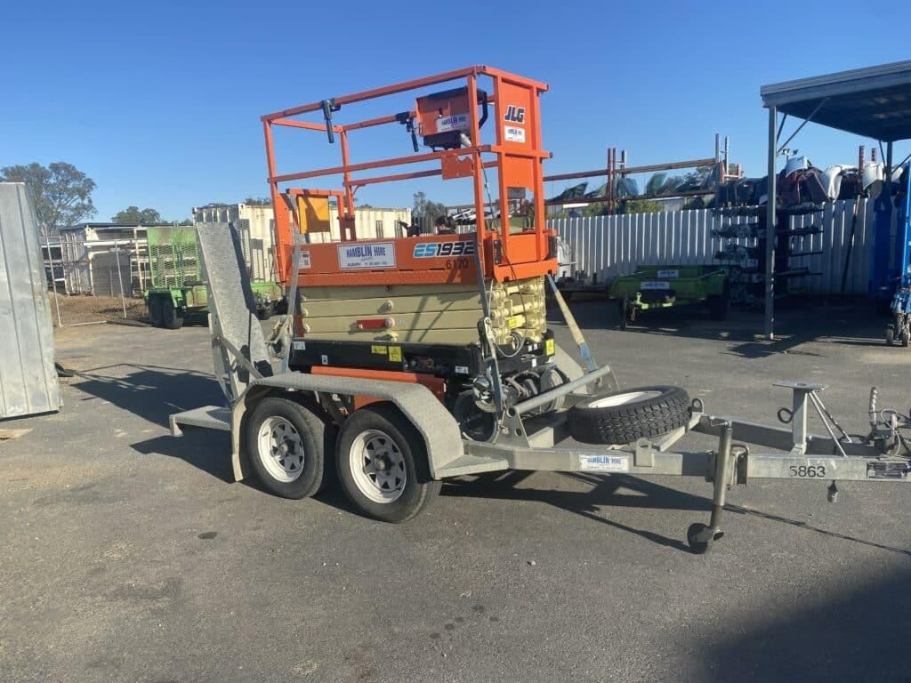 A Jlg Lift on a Trailer in a Parking Lot — Hamblin Hire in Albury, NSW