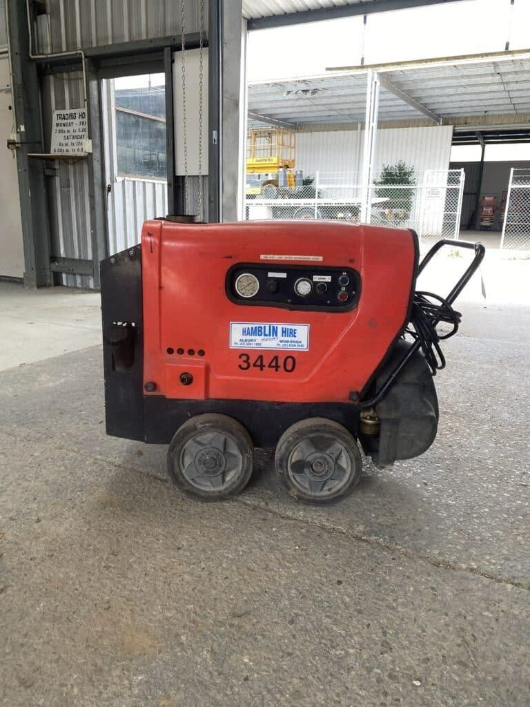 A Red and Black Machine With the Number 3440 on It is Parked in a Garage — Hamblin Hire in Albury, NSW