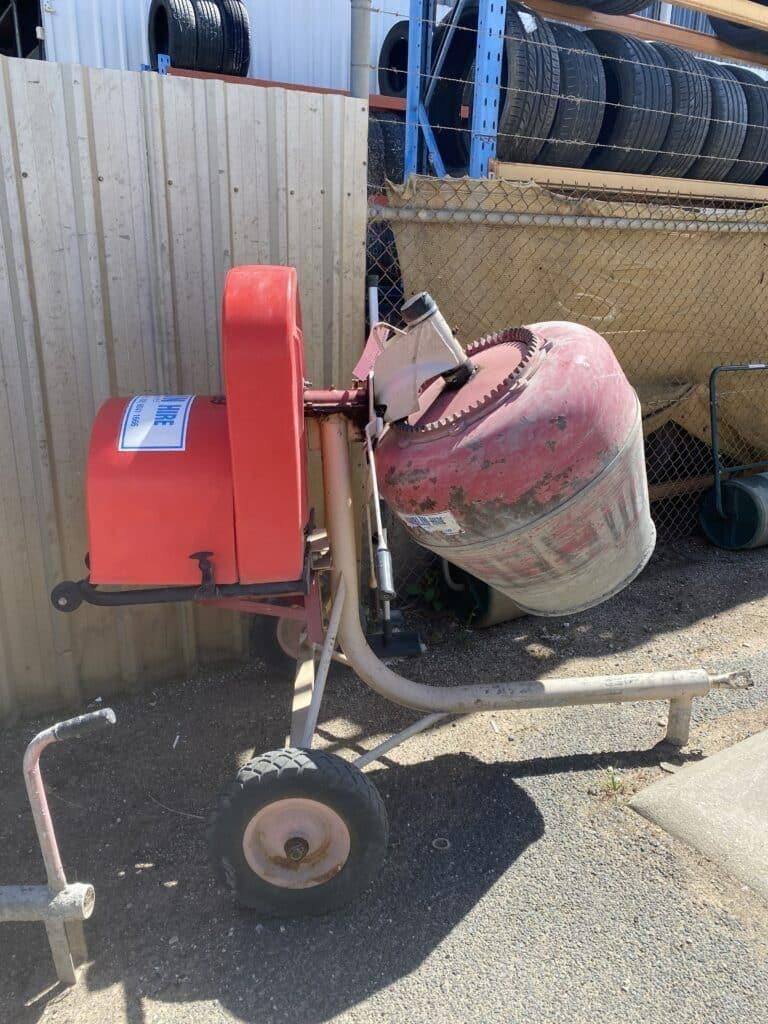 A Red and White Concrete Mixer is Parked in Front of a Fence — Hamblin Hire in Albury, NSW