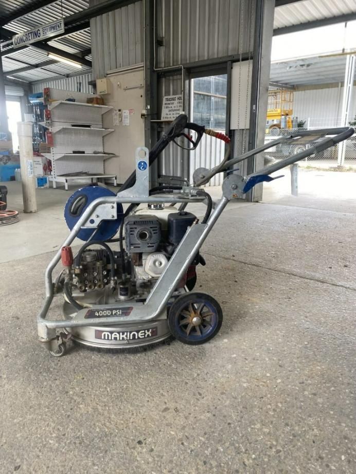 A Machine is Sitting on the Ground in a Garage — Hamblin Hire in Albury, NSW