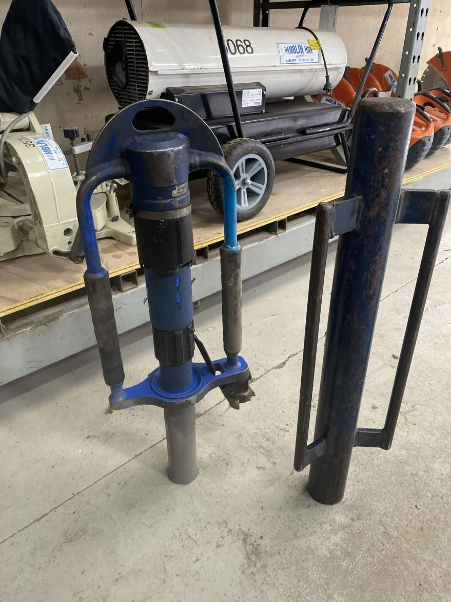 A Blue and Black Machine is Sitting on the Floor in a Warehouse — Hamblin Hire in Albury, NSW